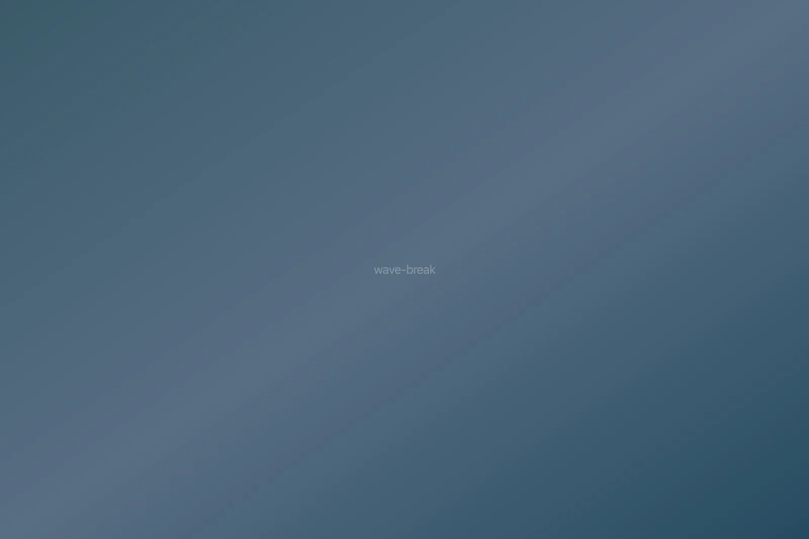 Wave breaking over rocky shoreline